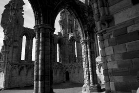 black and white photo of the facade Whitby Abbey in England