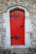 Red door at the entrance of the church