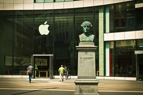 bust of a man near the building apple