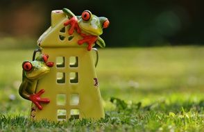 ceramic figurine in the form of frogs in the house