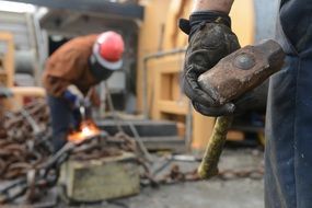 worker with a sledgehammer close up