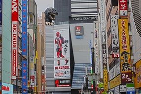 many banners on the facades of buildings in Tokyo