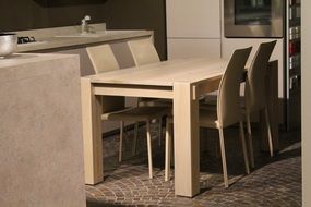 wooden tables with chairs in the street