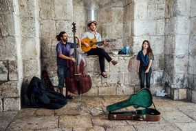 street musicians near a building in israel