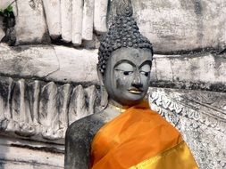 Buddha statue in a yellow dress