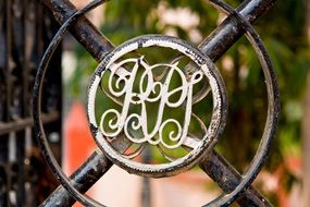 wrought iron door with monogram