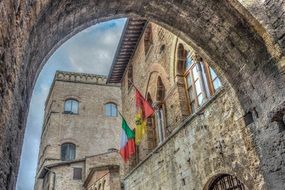 view through arch on the historical architecture of san gimignano