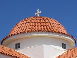 cross on the dome of the orthodox church in Liopetri on a clear sunny day