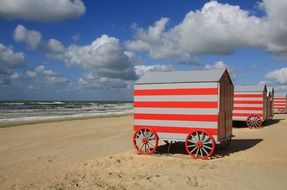 red and white beach cabins