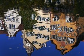 old houses reflecting in the water
