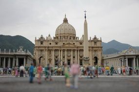 many people in the square in front of the cathedral