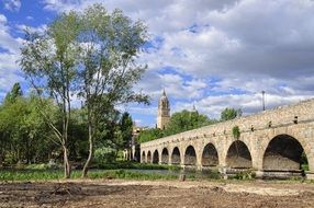Roman bridge of Salamanca across Tormes River at summer, spain