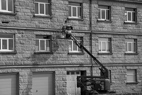 facade of a stone building in black and white background