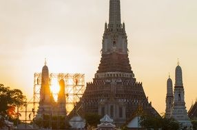 buddhist temple in thailand at sunset