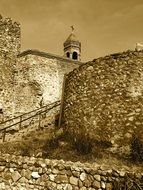 medieval Church behind stone wall, sepia, georgia, Tbilisi