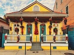 yellow house in christmas decorations