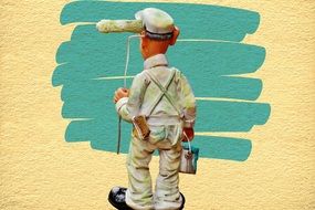 house painter stands near the wall
