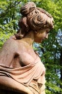 woman as a sculpture in a park