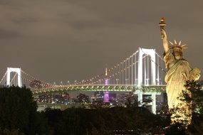 brooklyn bridge and Statue of Liberty at night