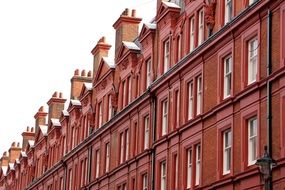 side view of the red facade of a building in London