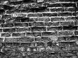 black and white photo of a brick wall