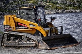 Backhoe loader working in the land