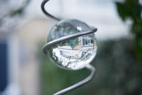 reflection of building on Glass ball in metal Spiral