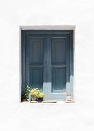 gray window on a white facade
