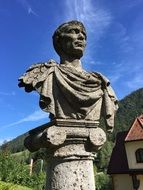 stone bust of the roman emperor in the bright sun