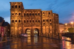city gate in rome in the evening