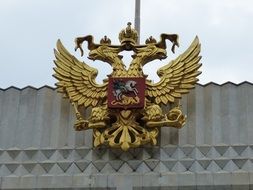 russian coats of arms with the double eagle on the building facade