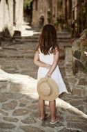 Girl in white dress with the hat in France