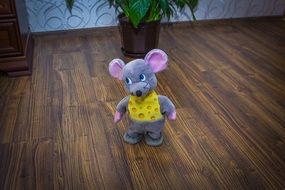 toy mouse stands on the floor