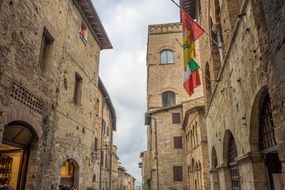 flags on building wall in italy