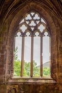 gothic window of Melrose Abbey in uk, Scotland