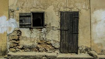 photo of damaged wall of on old house in cyprus