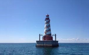 Scenic old spiral striped Lighthouse on Lake