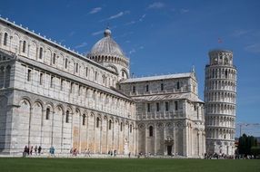 Leaning Tower of Pisa and Cathedral in Rome, Italy with a lot of people around