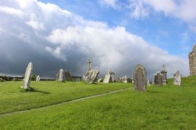 cloudy sky over an old cemetery