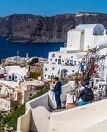 newlyweds on the coast in santorini, Italy