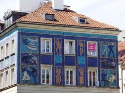 mosaic paintings on the facade of the building in Krakow