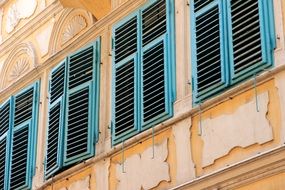 Window shutters on a wall close-up