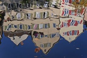 houses mirroring in the water