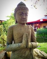 buddha statue in green garden