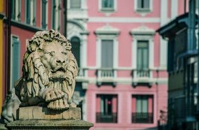 statue of a lion near the building in monza