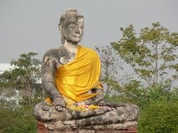 Beautiful Buddha statue among the plants in Thailand Sukhotai