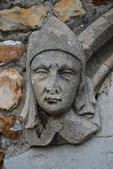 medieval stone sculpture, human face