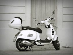 white scooter in black and white image
