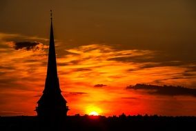spire of a church in Erfurt against the backdrop of a golden sunset