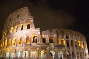 glowing colosseum at night